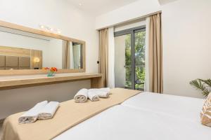 Voodi või voodid majutusasutuse Esperia Hotel toas