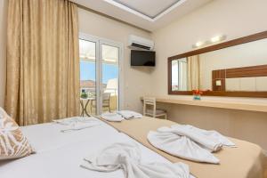 Voodi või voodid majutusasutuse Esperia Hotel toas