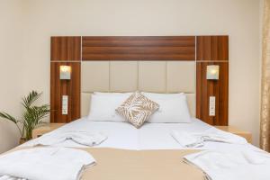 Voodi või voodid majutusasutuse Esperia Hotel toas