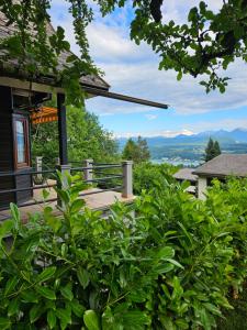 a view of the mountains from the porch of a house at Onkel Willis Hütte in Velden am Wörthersee