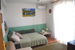 Postel nebo postele na pokoji v ubytování Orebic Garden House