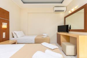 Voodi või voodid majutusasutuse Esperia Hotel toas