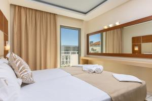 Voodi või voodid majutusasutuse Esperia Hotel toas