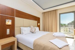 Voodi või voodid majutusasutuse Esperia Hotel toas