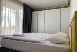 Posteľ alebo postele v izbe v ubytovaní Apartment Dolfi, Senec