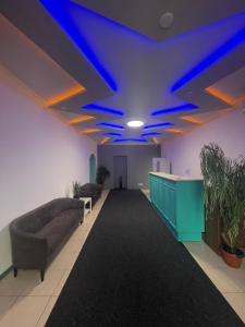 a room with a couch and a blue ceiling at Happy Home Hostel in Odesa