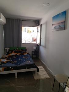 Ruang duduk di Plaza Caparica Hostel