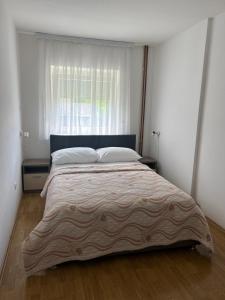 Postel nebo postele na pokoji v ubytování Apartments and Rooms Krizmanic