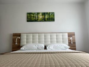 Postel nebo postele na pokoji v ubytování Apartments and Rooms Krizmanic