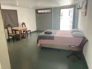 Cama ou camas em um quarto em Studio do morro