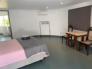 Cama ou camas em um quarto em Studio do morro
