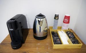 a coffee maker and a blender on a table at HM Boutique Hotel in Krujë