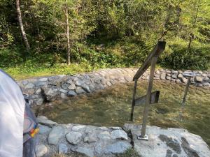 a wooden cross in a pond of water at Adventure Panorama Hochalp Top 7 in Warth am Arlberg +2 photos