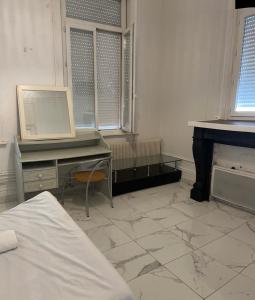 Postel nebo postele na pokoji v ubytování Chambre calaisfornia