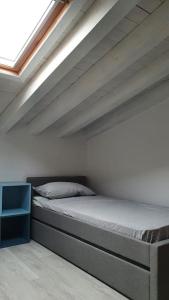 Postel nebo postele na pokoji v ubytování Garda Lake Attic