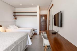 Postel nebo postele na pokoji v ubytování Hotel Paraiso do Morro