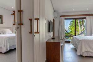 Postel nebo postele na pokoji v ubytování Hotel Paraiso do Morro