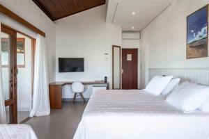 Postel nebo postele na pokoji v ubytování Hotel Paraiso do Morro