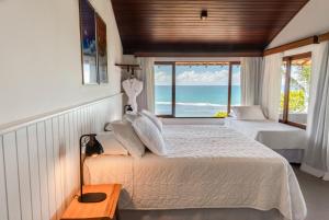 Postel nebo postele na pokoji v ubytování Hotel Paraiso do Morro + 37 fotografií