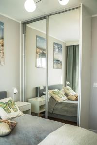 Postel nebo postele na pokoji v ubytování APARTAMENT SłONECZNY