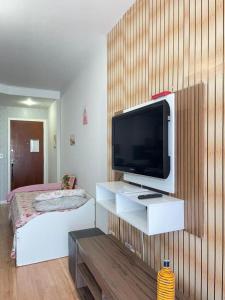 Et tv og/eller underholdning på Residencial Green Diamond