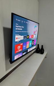 TV a/nebo společenská místnost v ubytování Pousada e Lofts Marabá Quarto 4