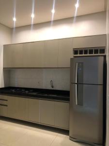 Kuchyň nebo kuchyňský kout v ubytování Pousada e Lofts Marabá Quarto 4