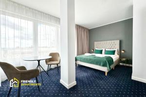 Ένα ή περισσότερα κρεβάτια σε δωμάτιο στο SERENITY Aparthotels - Old Town Poznan by Friendly Apartments +36 φωτογραφίες