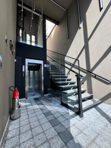 a staircase in a building with a fire hydrant at Studio Aconchegante in Poços de Caldas