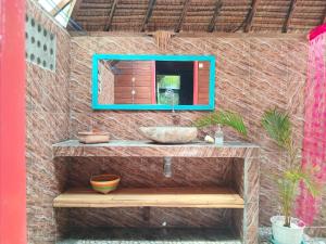 a bathroom with a sink and a mirror on a wall at UTOPIA in Gili Air +89 photos