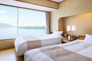 Letto o letti in una camera di Amano Hashidate Hotel