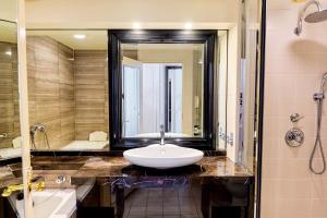 a bathroom with a sink and a large mirror at InterContinental Tokyo Bay by IHG in Tokyo