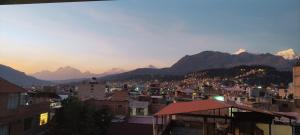 a view of a city with mountains in the background at Guest house. Shared room in panoramic apartment. Private bathroom. Kitchen and washmachine in Huaraz