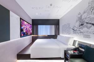 Postel nebo postele na pokoji v ubytování CitiGO Hotel Yuexiu Ouzhuang MTR Station Ghuangzhou - Free shuttle between hotel and Exhibition Center during Canton Fair