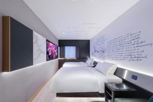 Postel nebo postele na pokoji v ubytování CitiGO Hotel Yuexiu Ouzhuang MTR Station Ghuangzhou - Free shuttle between hotel and Exhibition Center during Canton Fair