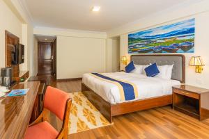 Letto o letti in una camera di Kathmandu Business Hotel