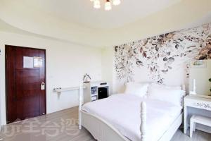 Voodi või voodid majutusasutuse Dibao 16 Homestay toas