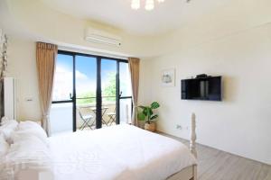Voodi või voodid majutusasutuse Dibao 16 Homestay toas