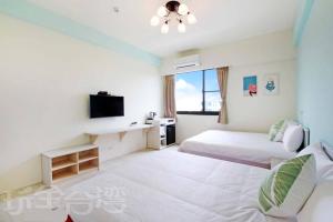 Voodi või voodid majutusasutuse Dibao 16 Homestay toas