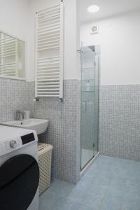 a bathroom with a shower and a sink at Residential lifestyle in Fano +16 photos