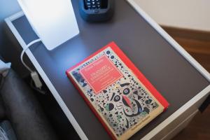 two books sitting on top of a desk at Residential lifestyle in Fano