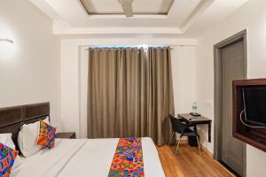 Postel nebo postele na pokoji v ubytování FabHotel Kaushambi