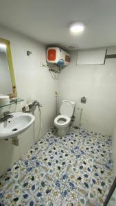 a bathroom with a toilet and a sink at Era Apartment La Thành in Hanoi +28 photos