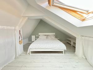 a bedroom with a bed in a attic at Appartement duplex cosy Saint Servan centre in Saint Malo