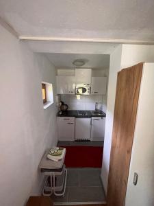 Kuchyň nebo kuchyňský kout v ubytování Ferienhaus Waldblick