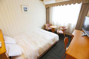 Postel nebo postele na pokoji v ubytování Hotel Castle Inn Ise Meotoiwa
