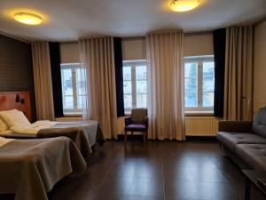 Postel nebo postele na pokoji v ubytování Hotel Lasaretti