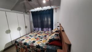 Ένα ή περισσότερα κρεβάτια σε δωμάτιο στο Tahara'a Beach Bungalow