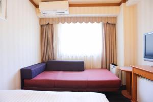 Postel nebo postele na pokoji v ubytování Hotel Castle Inn Ise Meotoiwa