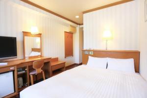Postel nebo postele na pokoji v ubytování Hotel Castle Inn Ise Meotoiwa